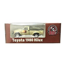 Load image into Gallery viewer, BM Creations 1/64 Toyota 1980 Hilux N60/N70 (LHD) Ivory
