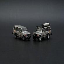 Load image into Gallery viewer, BM Creations Junior 1:64 Mitsubishi Pajero MK1 Silver LHD
