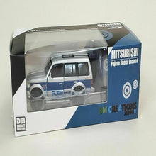 Load image into Gallery viewer, BM Creations Junior 1:64 Mitsubishi Pajero Blue Stripe
