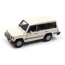 Load image into Gallery viewer, BM Creations Junior 1:64 Mitsubishi Pajero Mk1 w/ blk top Matte Ivory RHD
